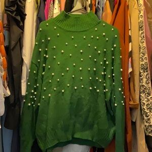 Winter green sweater with pearls.